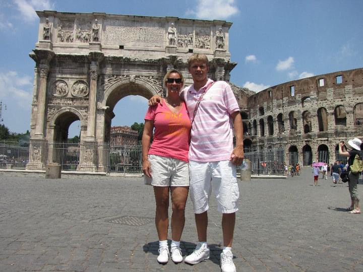 Stacey Sandlin Benas Veikalas Mortgage Broker Slam Dunk Mortgage Team Viera Melbourne Florida, family travels at the Arch of Constantine in Rome, standing in front of the iconic Arch of Constantine, located in Rome, Italy.