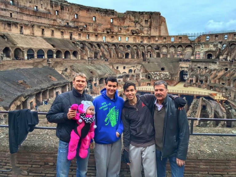 Stacey Sandlin Benas Veikalas Mortgage Broker Slam Dunk Mortgage Team Viera Melbourne Florida, family travels at Colosseum ruins in Rome. Standing in front of the ancient Colosseum. The iconic amphitheater’s weathered stone walls and arches provide a striking backdrop.